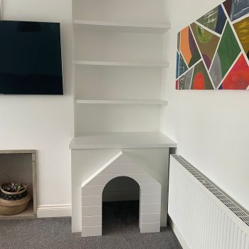 Alcove shelving with dog house below
