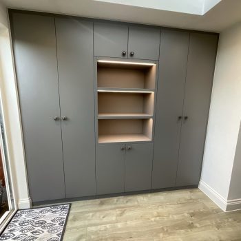 Hallway storage cabinet with central display shelves fitted in Essex