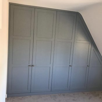 Shaker style wardrobe doors fitted into loft.