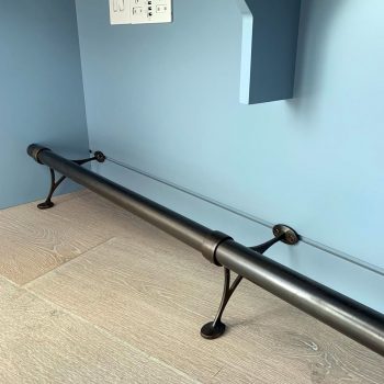 Foot rail fitted underneath home office, bespoke metal work for bespoke joinery
