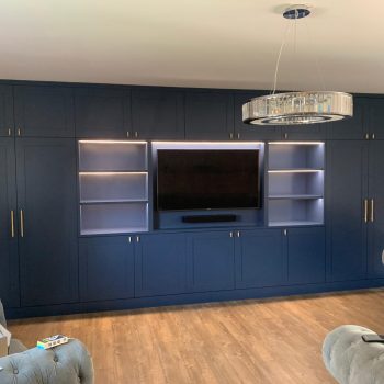 Bespoke Media wall fitted into a Essex home paint to the joinery is Farrow and Ball Stiffkey Blue